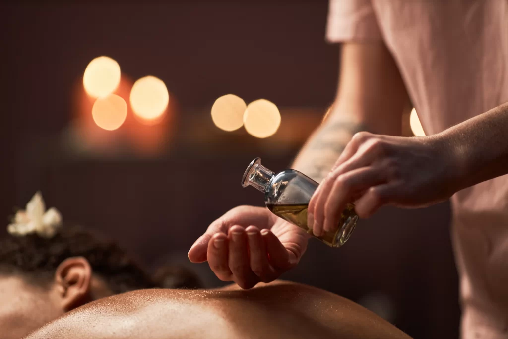 spa therapist applying massage oil 2026 03 20 04 33 12 utc