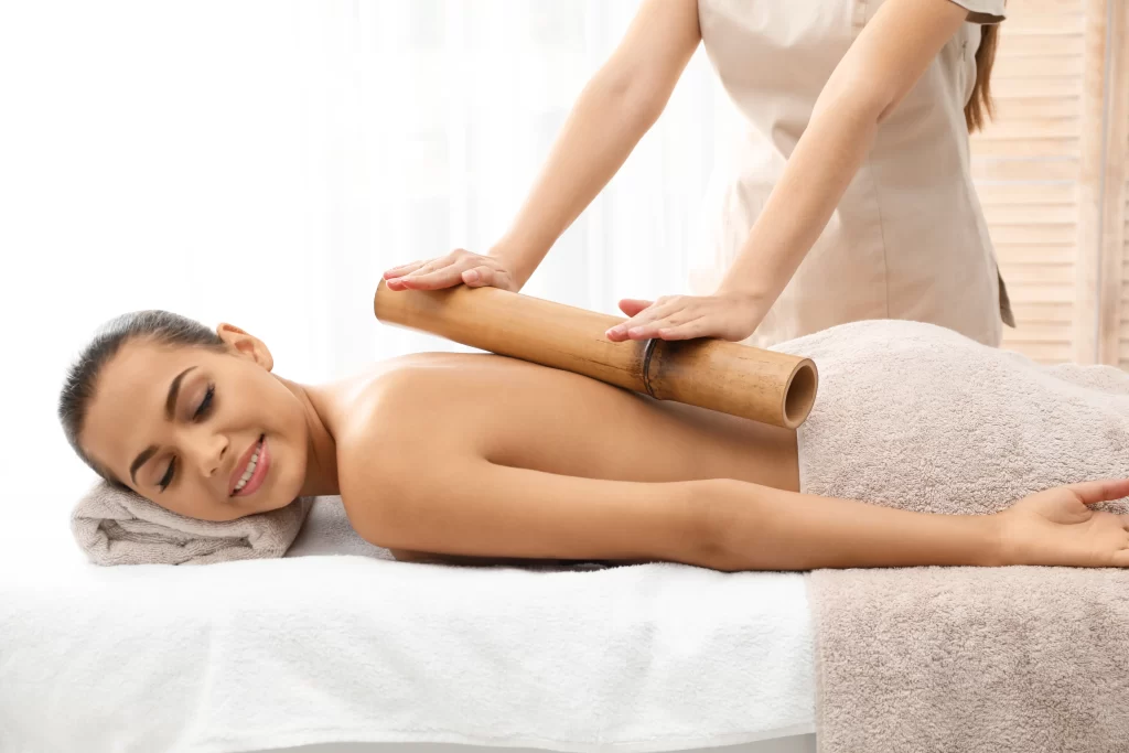 young woman having massage with bamboo stick in we 2026 03 05 11 46 09 utc